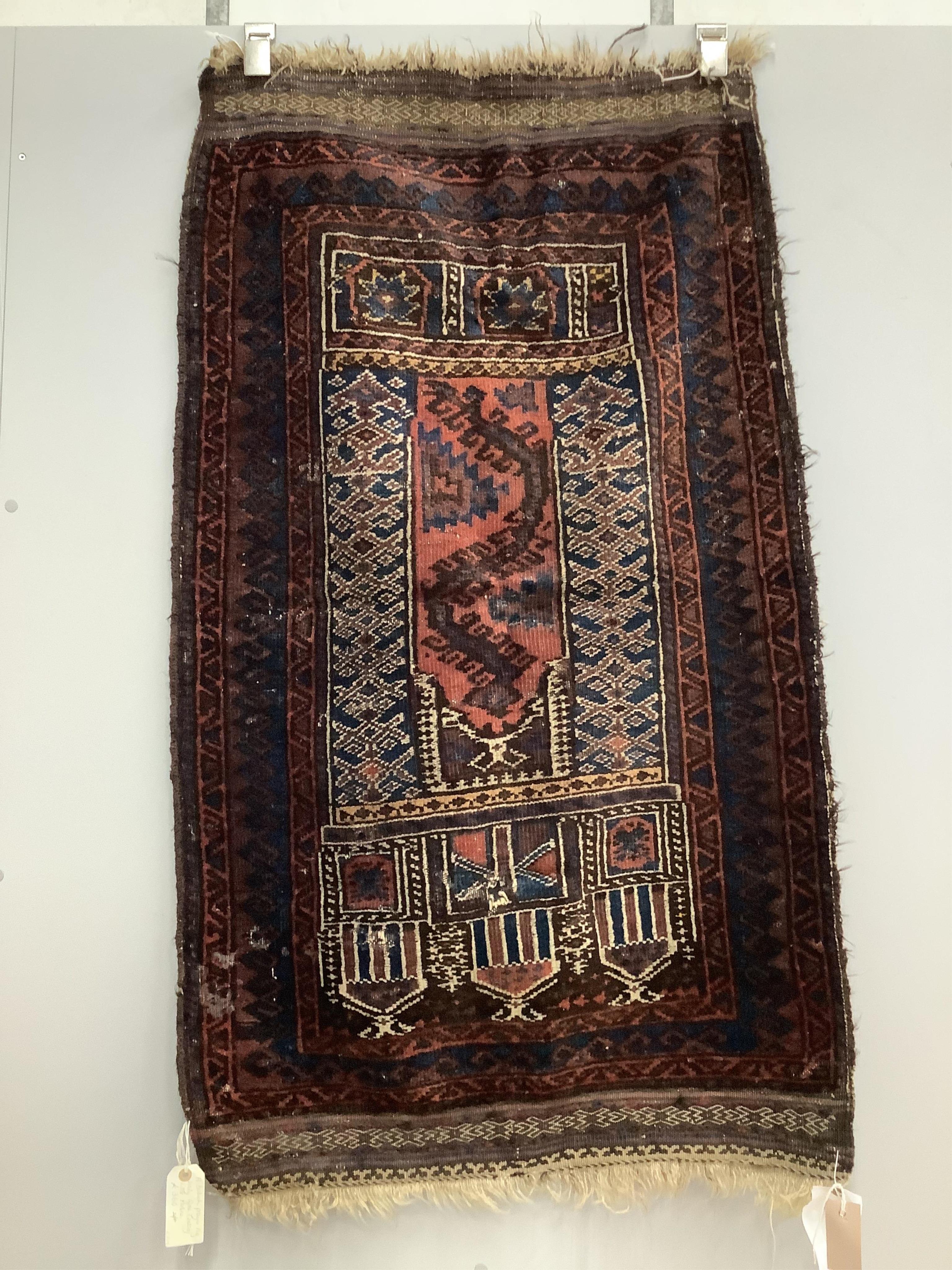 A Baluch prayer rug, 130 x 78cm. Condition - poor